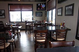Tables at Lumberyard Bar & Grill Restaurant Attached to Woodfield Inn & Suites